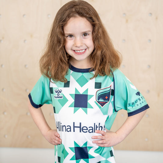 Teal and white soccer jersey with geometric star patterns