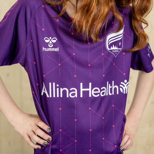 Purple soccer jersey decorated with pink stars and lines