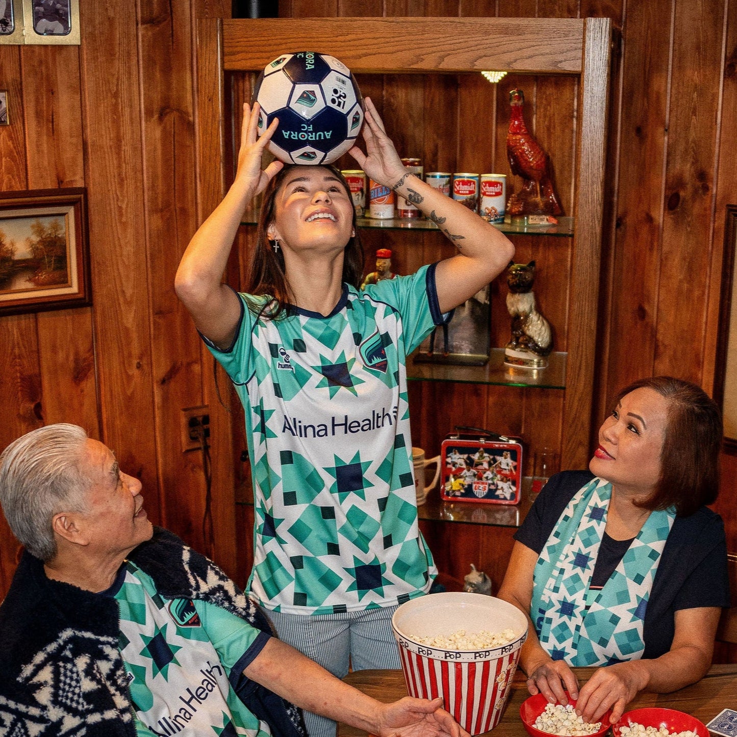 Teal and white soccer jersey with geometric star patterns