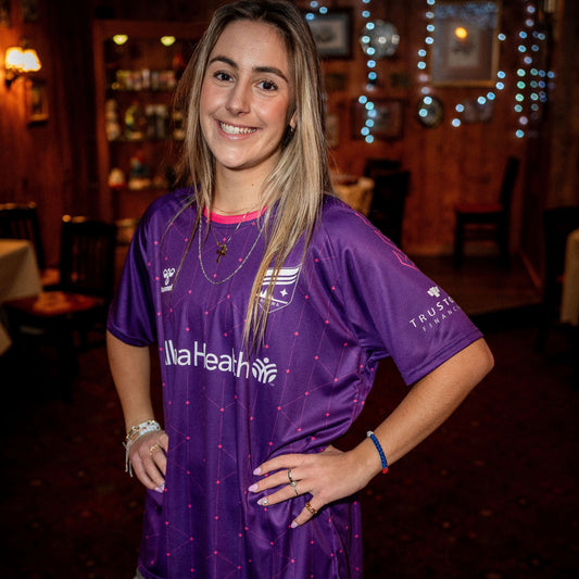 Purple soccer jersey decorated with pink stars and lines