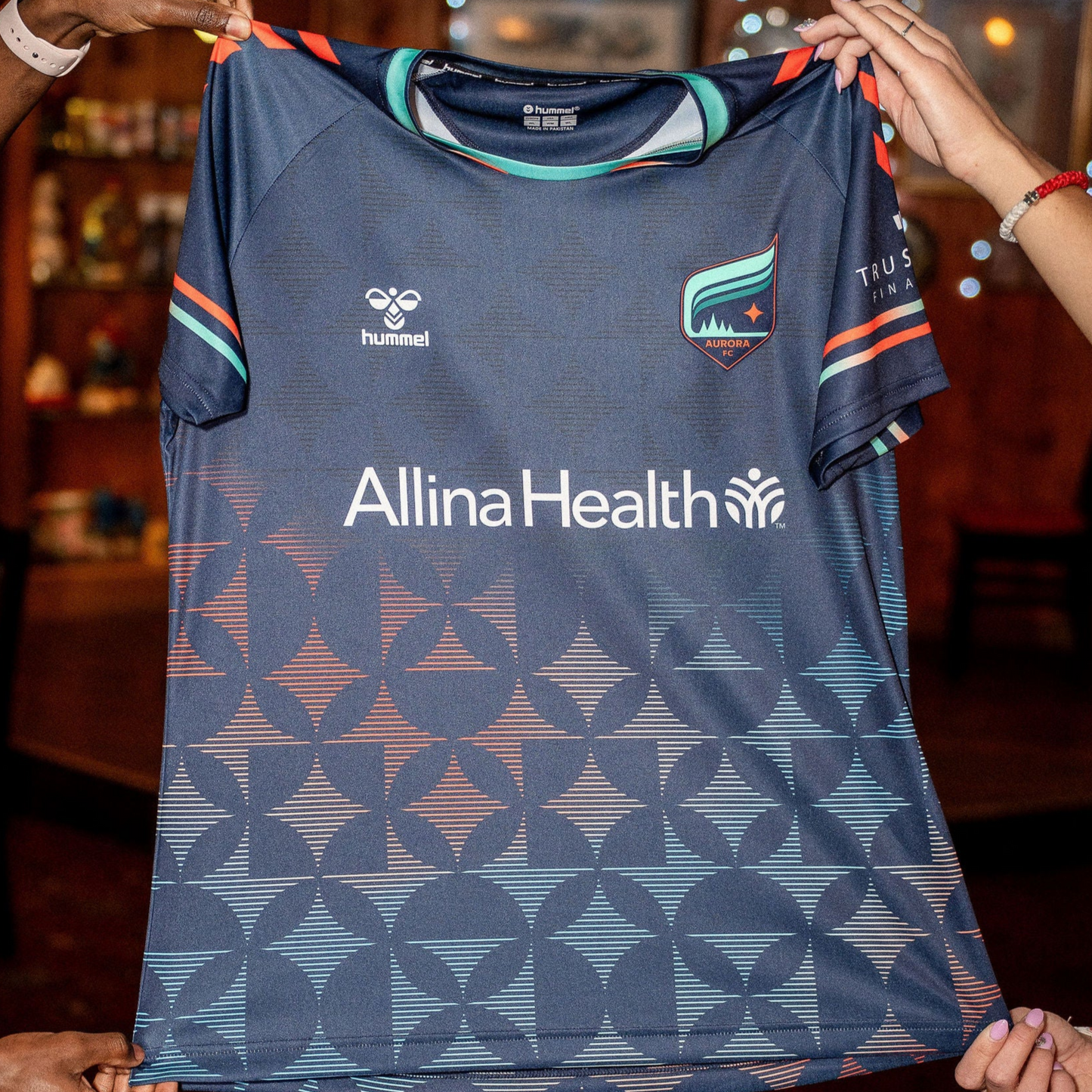 Navy soccer jersey with orange and blue gradient star pattern
