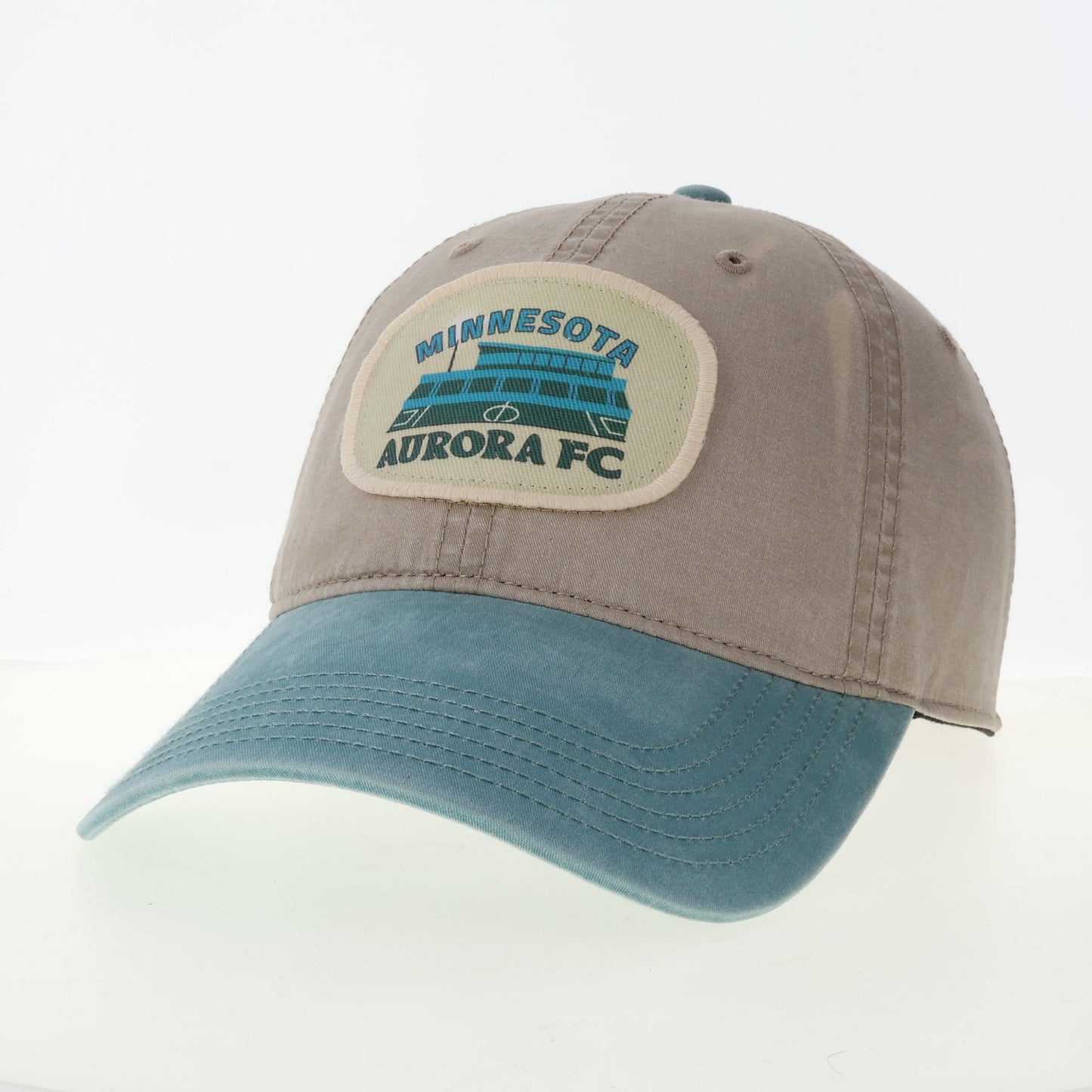 Gray and blue cap with Minnesota Aurora FC logo on a white background