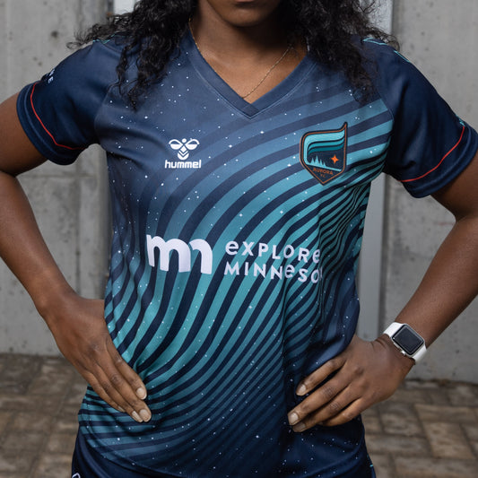 Navy soccer jersey with teal wavy pattern and orange accents