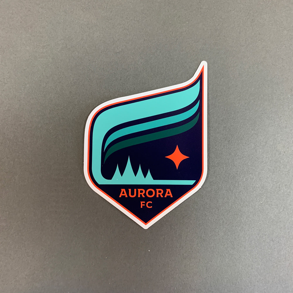A magnet of the Aurora crest with a white outline